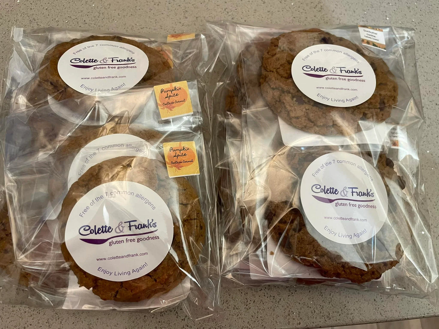 Packages of gluten-free cookies with visible branding.