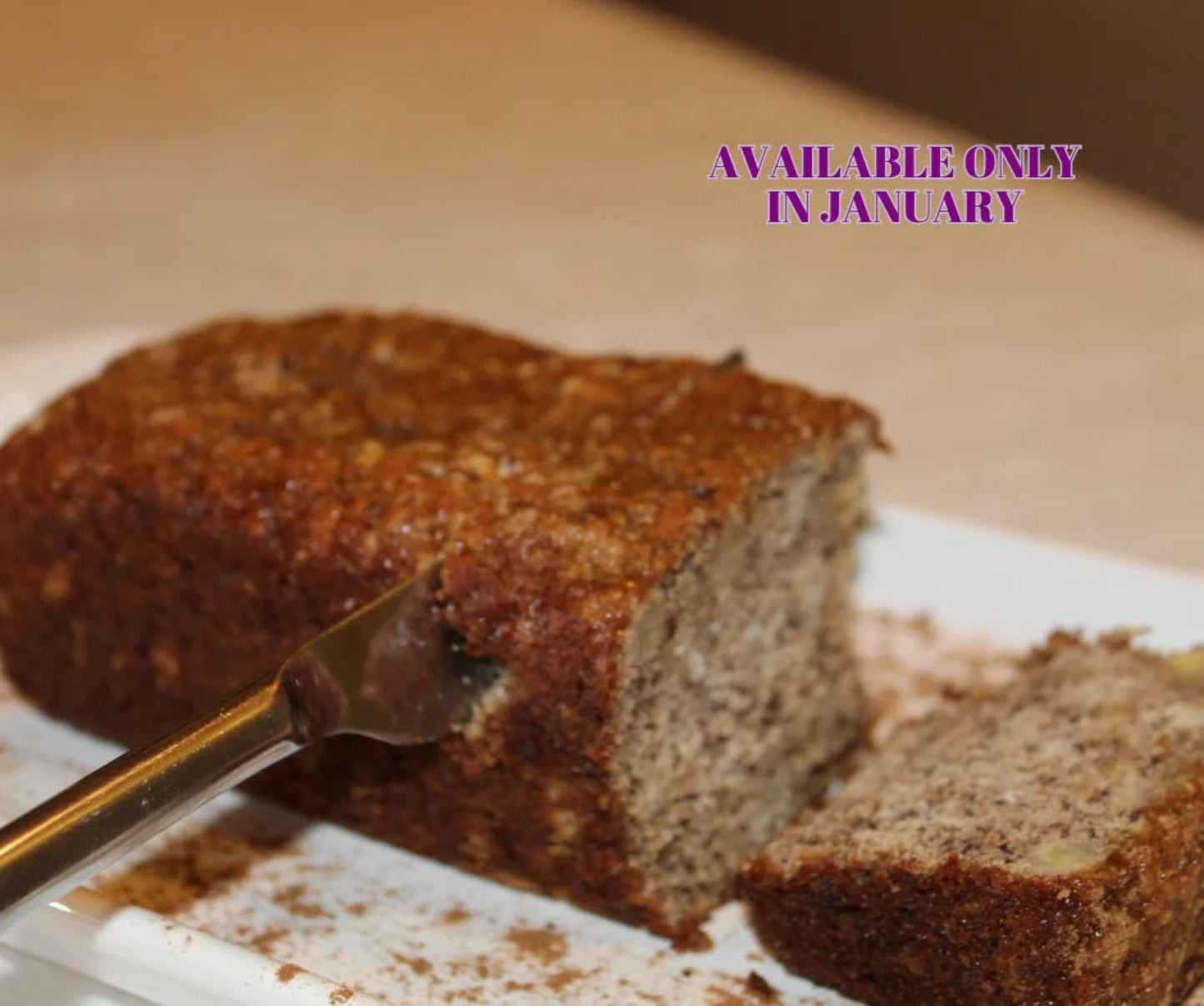 Chai banana bread with a slice cut, on a plate with a fork.