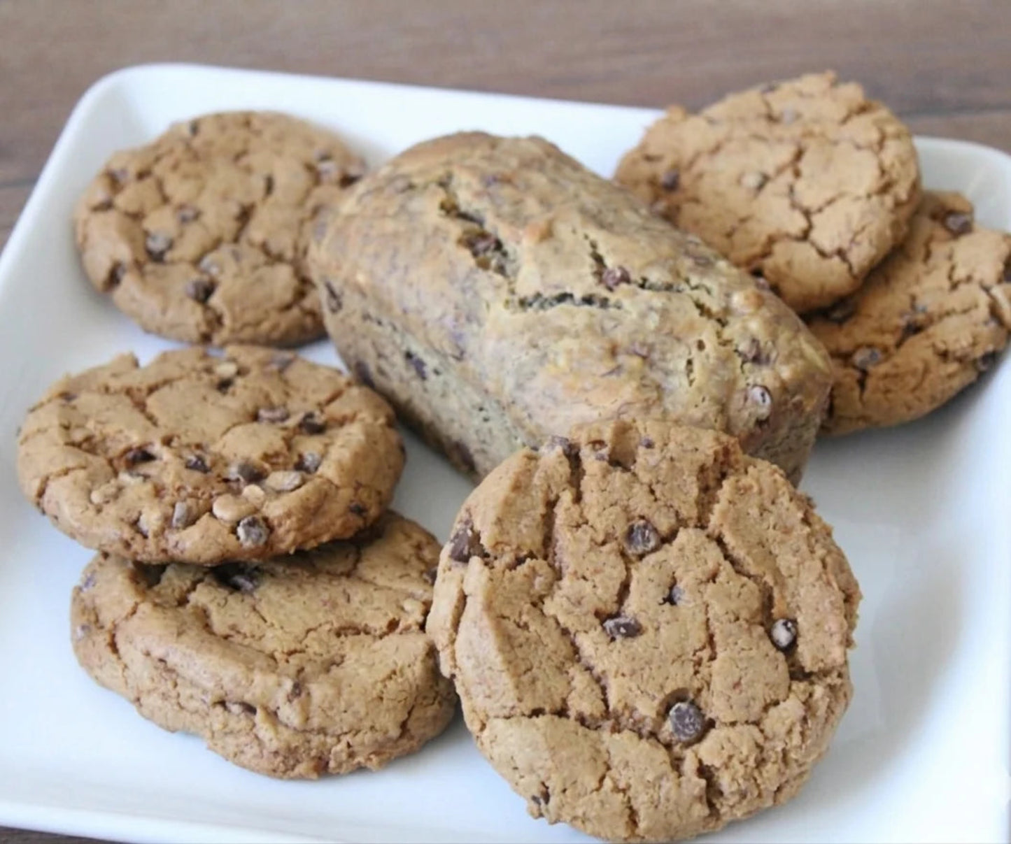 Cookies with chocolate chips on a white plate
